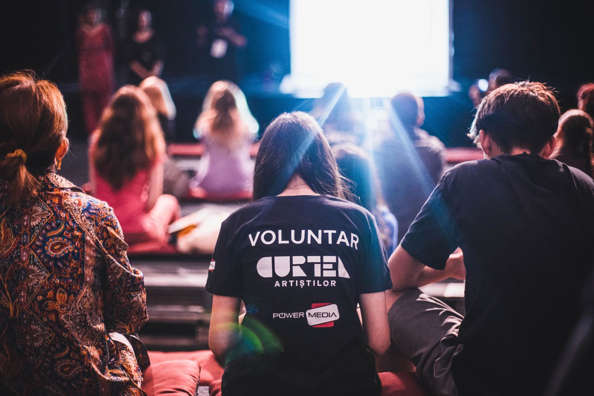 Pro Teatru volunteers in the audience at a festival event